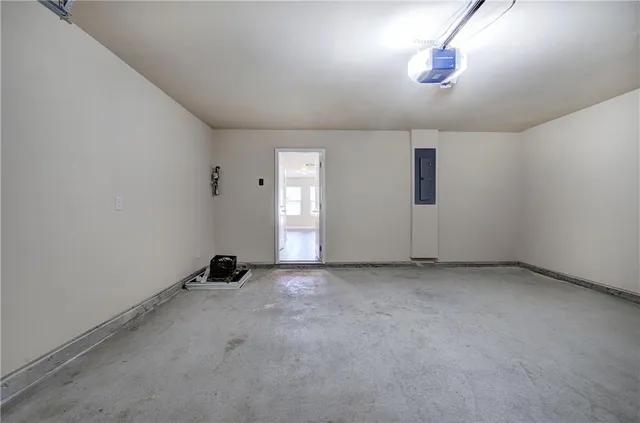 an empty room with ceiling fan