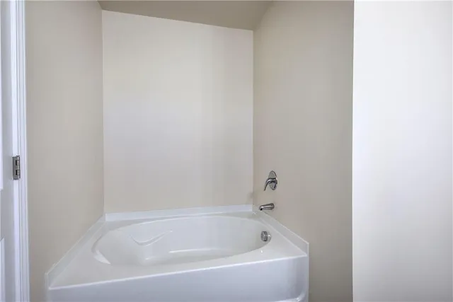 a white bath tub and shower