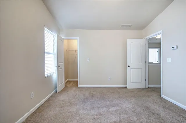 a view of an empty room and window