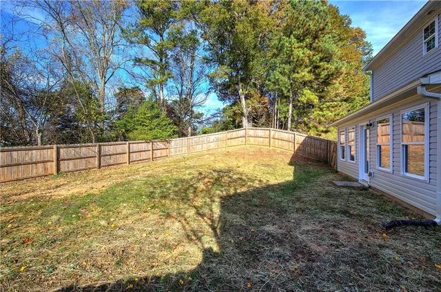 a view of backyard with green space