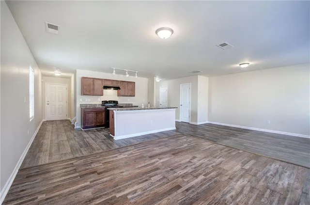 a view of kitchen with wooden floor