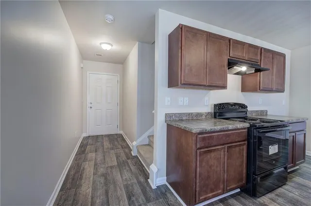 a kitchen with a stove and a sink