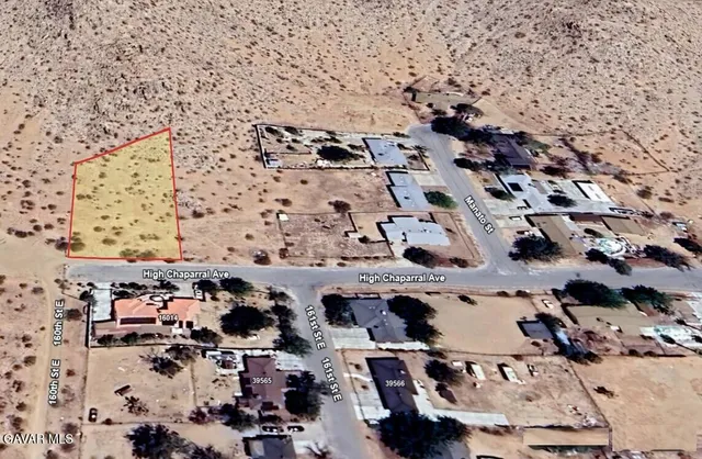 an aerial view of beach with parking space