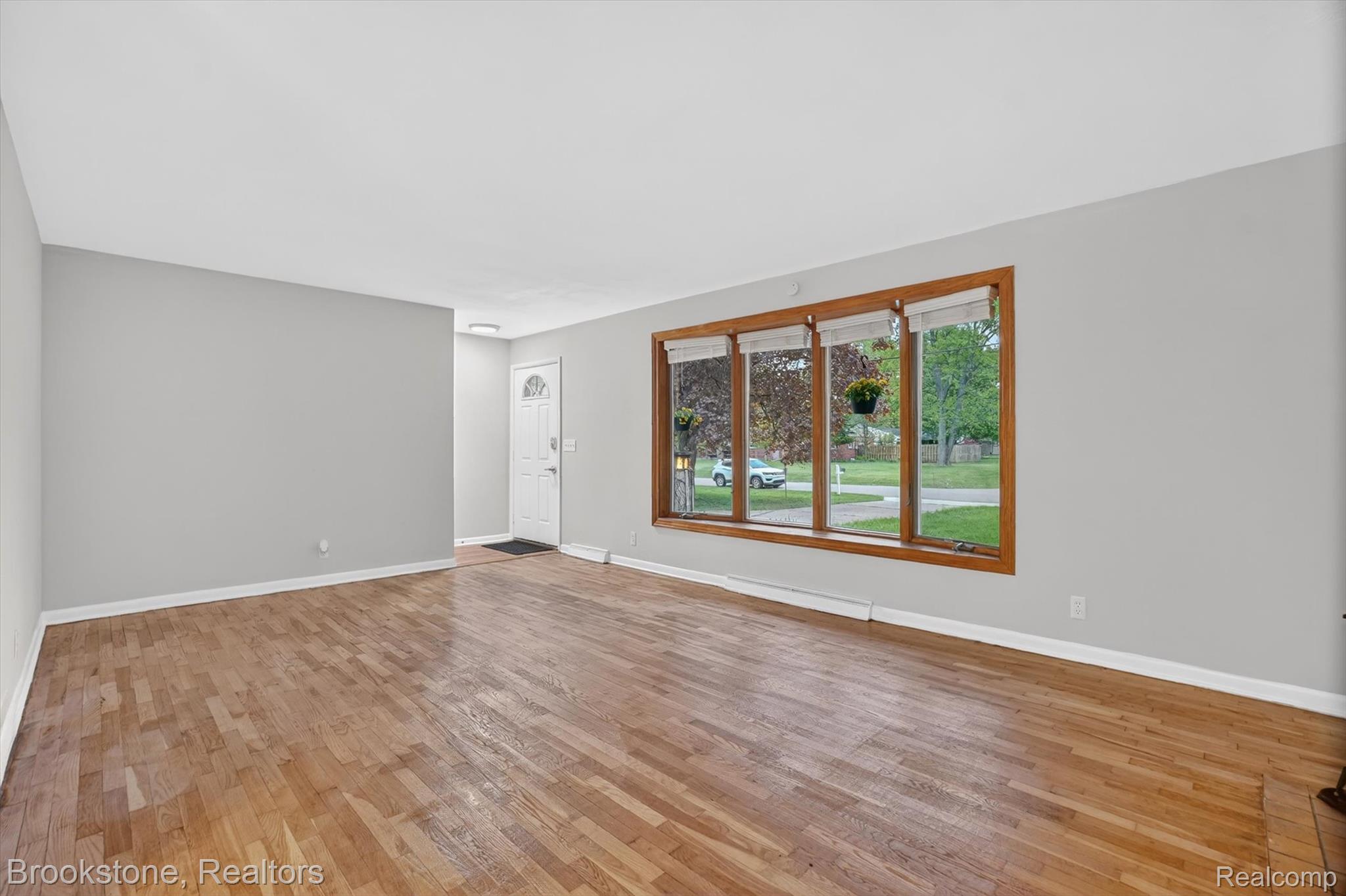4547 Marlborough Road Okemos, MI 48864 - Photo 5 of 55 Empty room with light wood-type flooring and baseboards