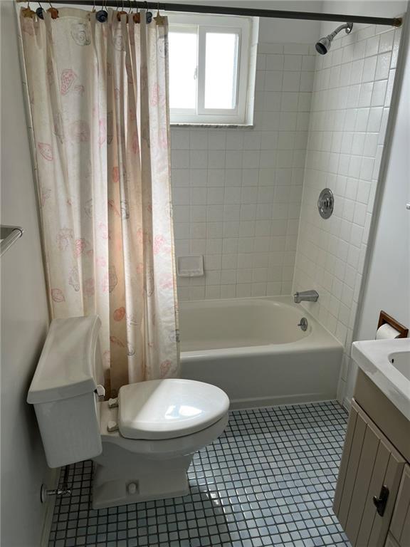 544 Old Frankstown Road Monroeville, PA 15146 - Photo 2 of 12 a bathroom with a sink a toilet a window and a shower
