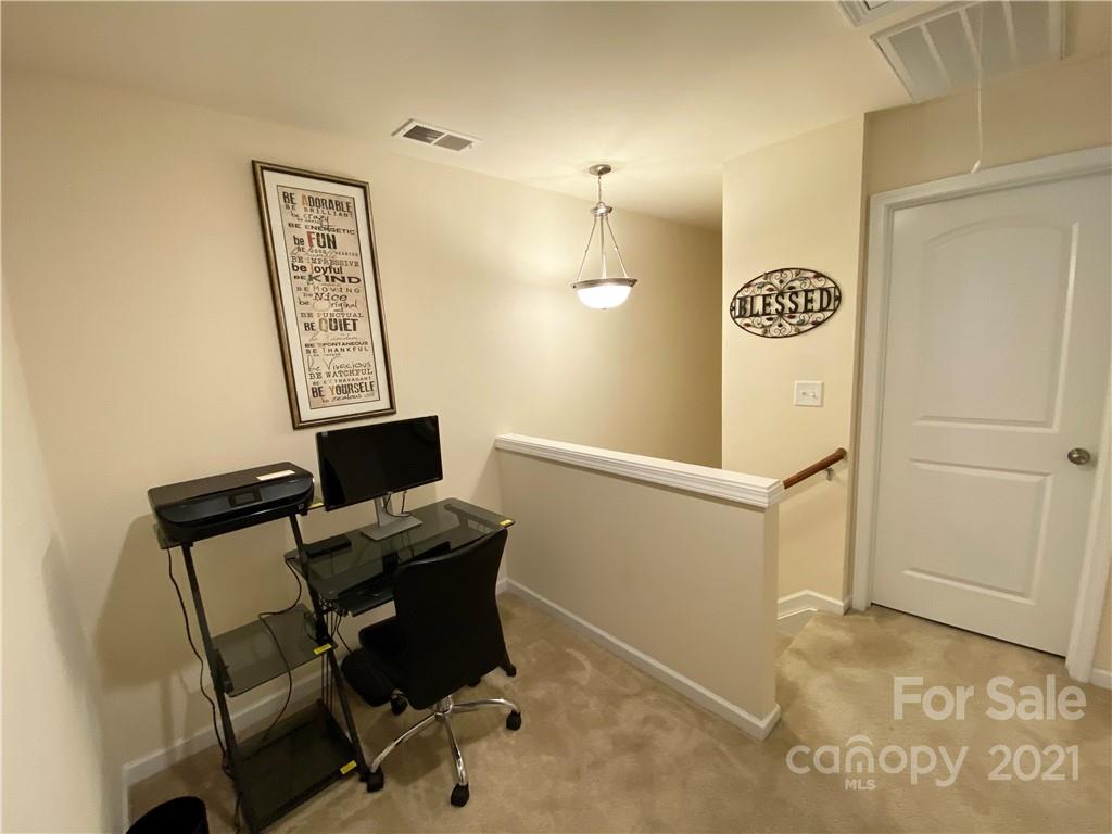 6339 Prosperity Church Road Charlotte, NC 28269 - Photo 12 of 21 a view of a workspace with furniture
