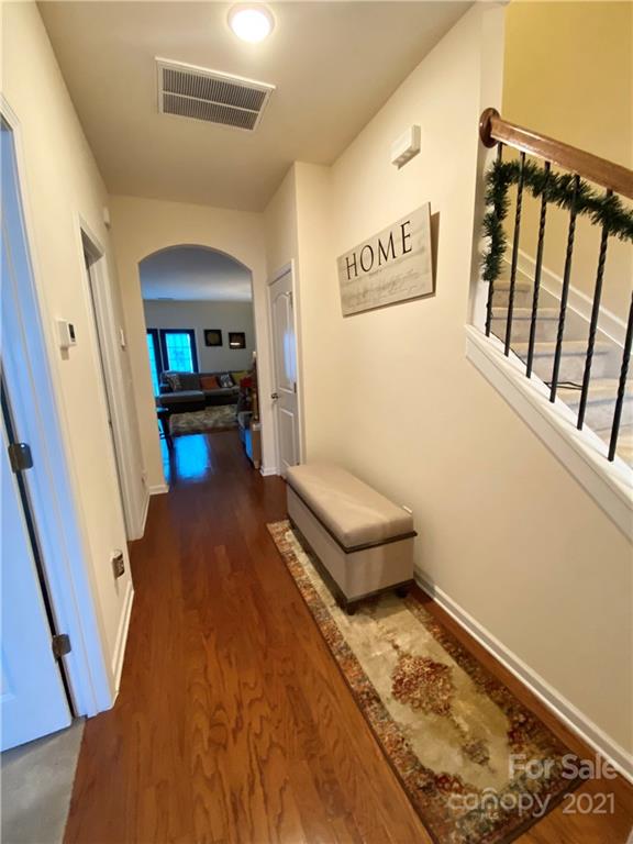 6339 Prosperity Church Road Charlotte, NC 28269 - Photo 3 of 21 a living room with furniture and a wooden floor
