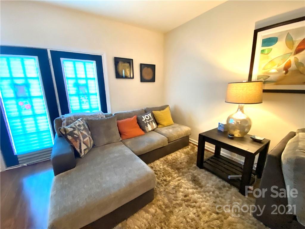 6339 Prosperity Church Road Charlotte, NC 28269 - Photo 10 of 21 a living room with furniture and a window
