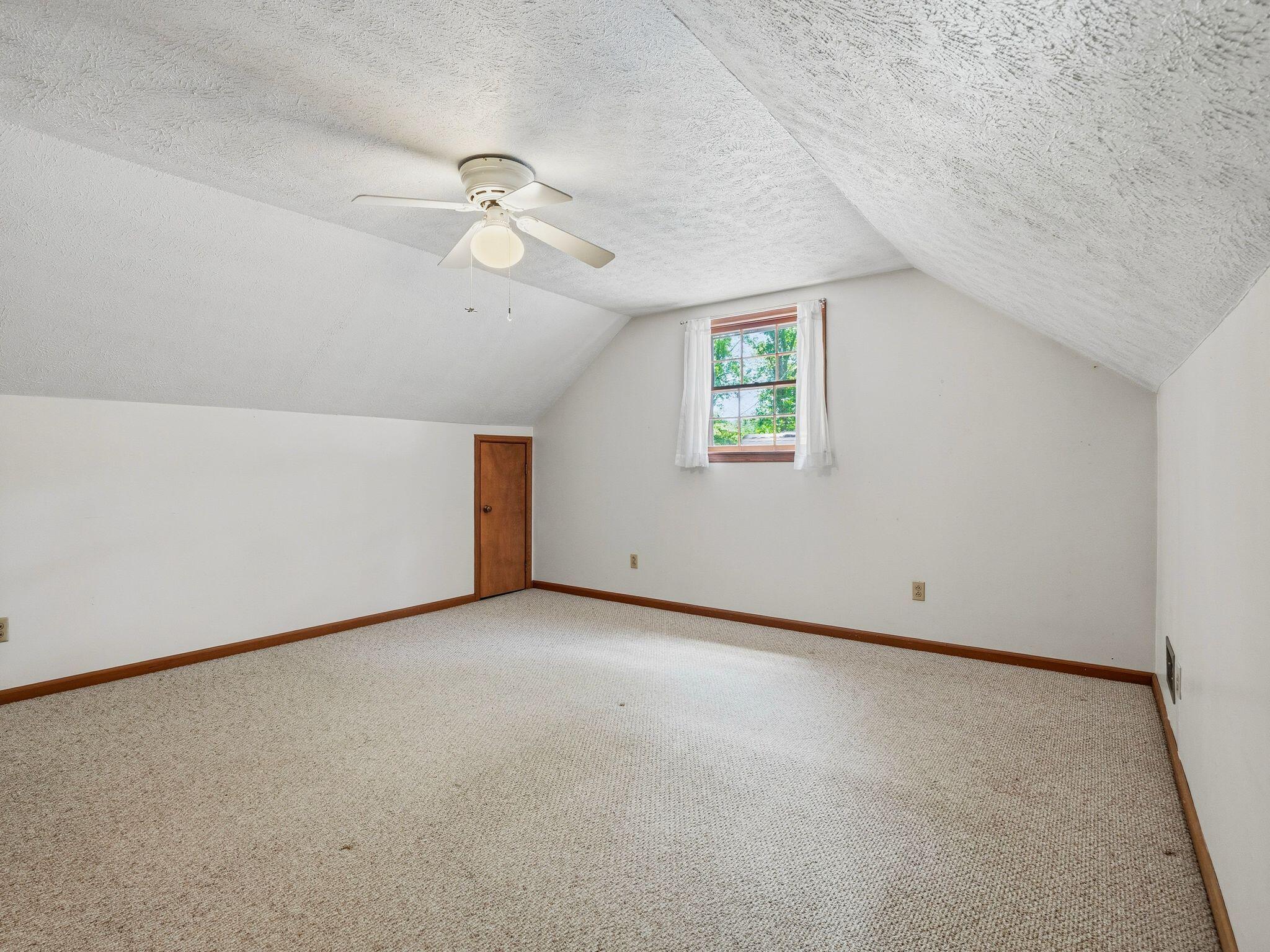 1115 Robin Ridge Road Henry, VA 24102 - Photo 29 of 54 an empty room with a window and a ceiling fan