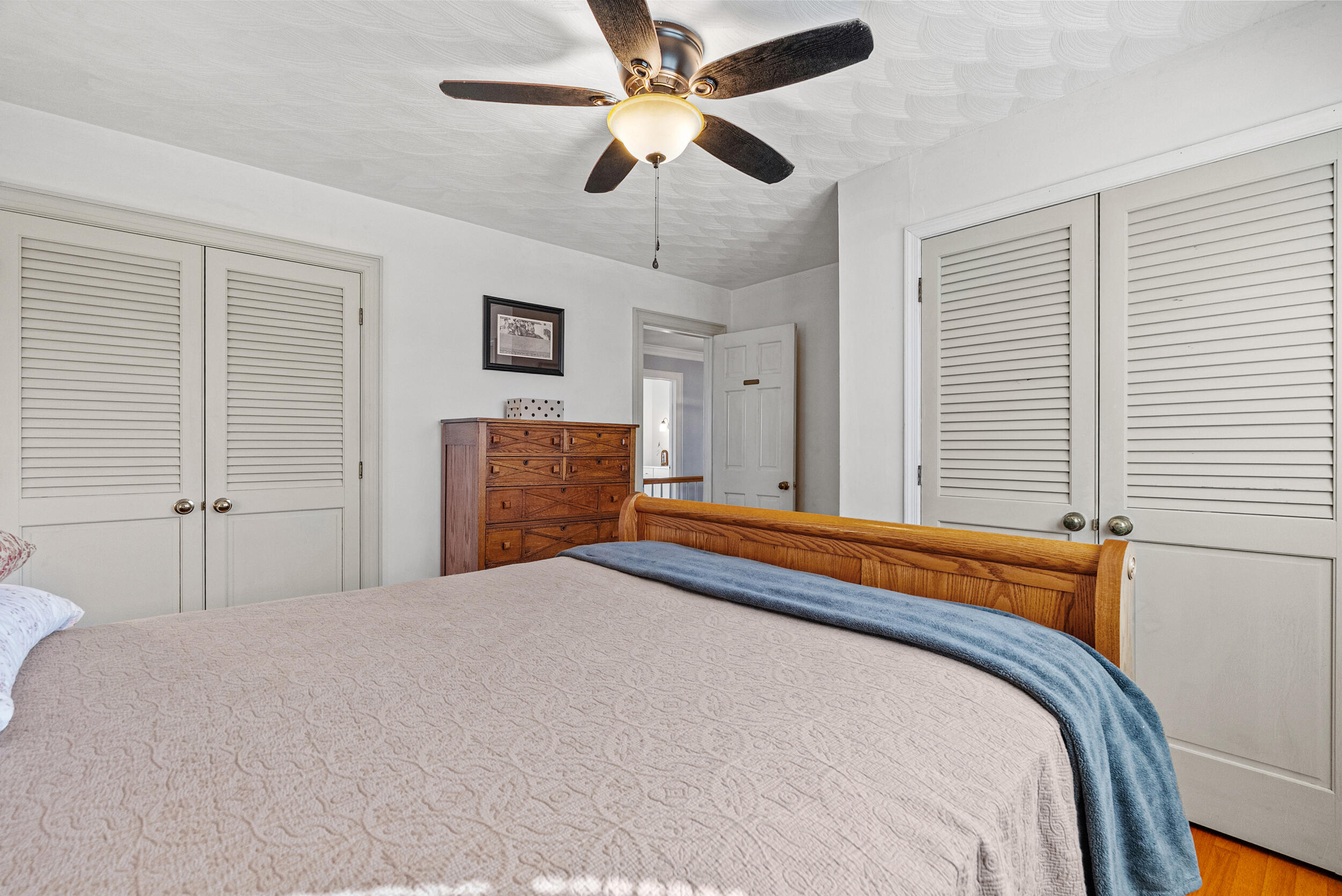 2631 Meadors Spur Road Moneta, VA 24121 - Photo 33 of 87 a bedroom with a bed and a chandelier