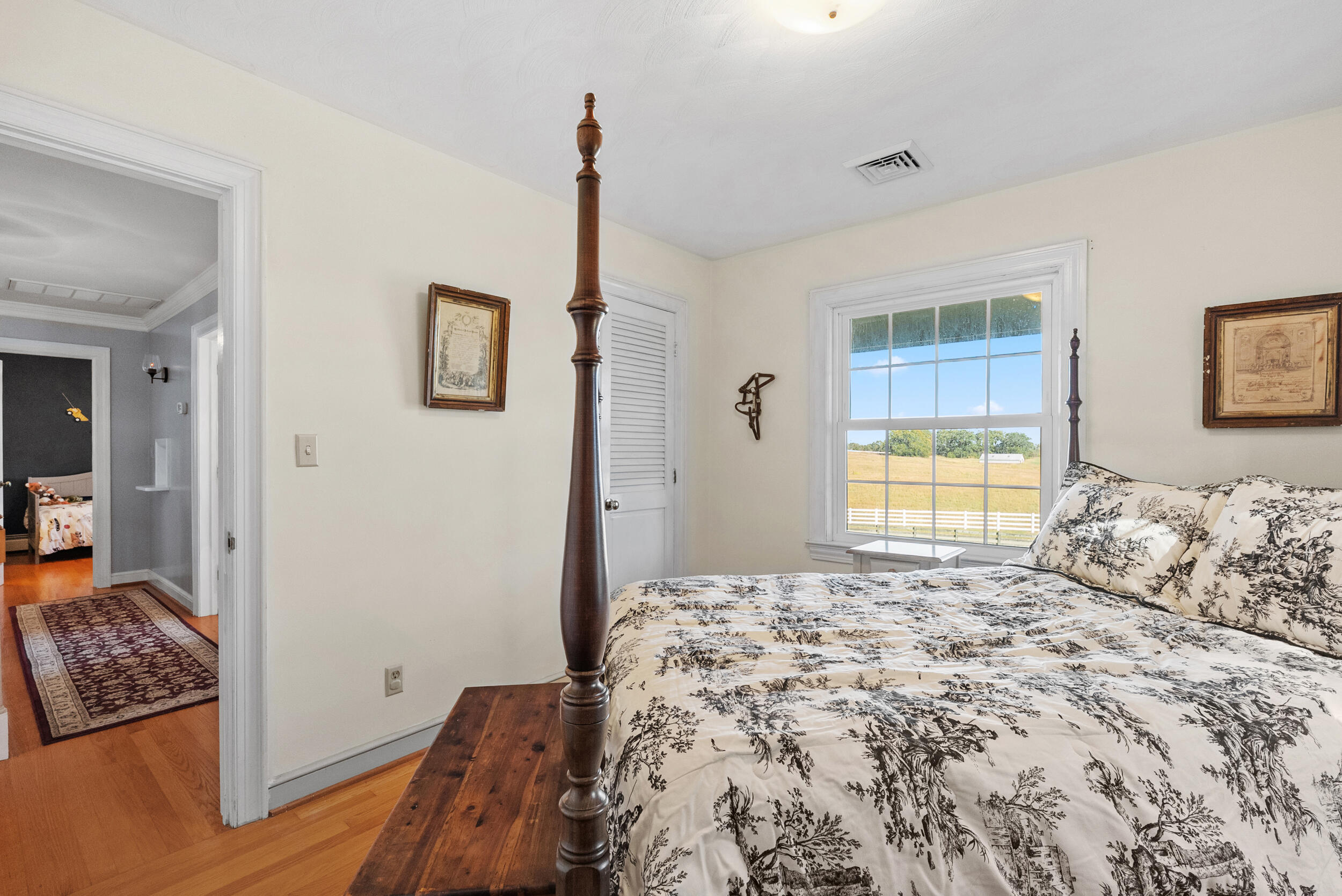 2631 Meadors Spur Road Moneta, VA 24121 - Photo 37 of 87 a bedroom with a bed and wooden floor