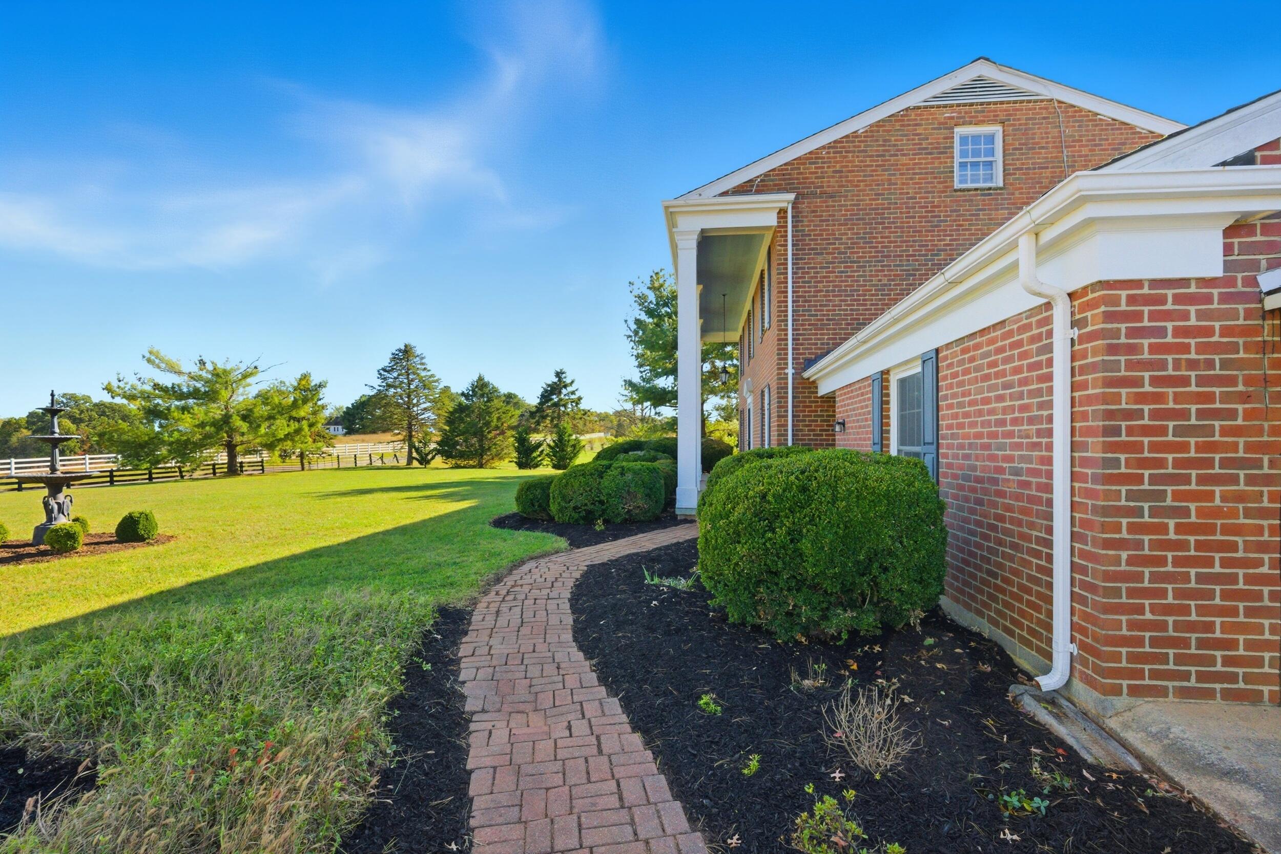 2631 Meadors Spur Road Moneta, VA 24121 - Photo 4 of 87 brick walkway with flower beds