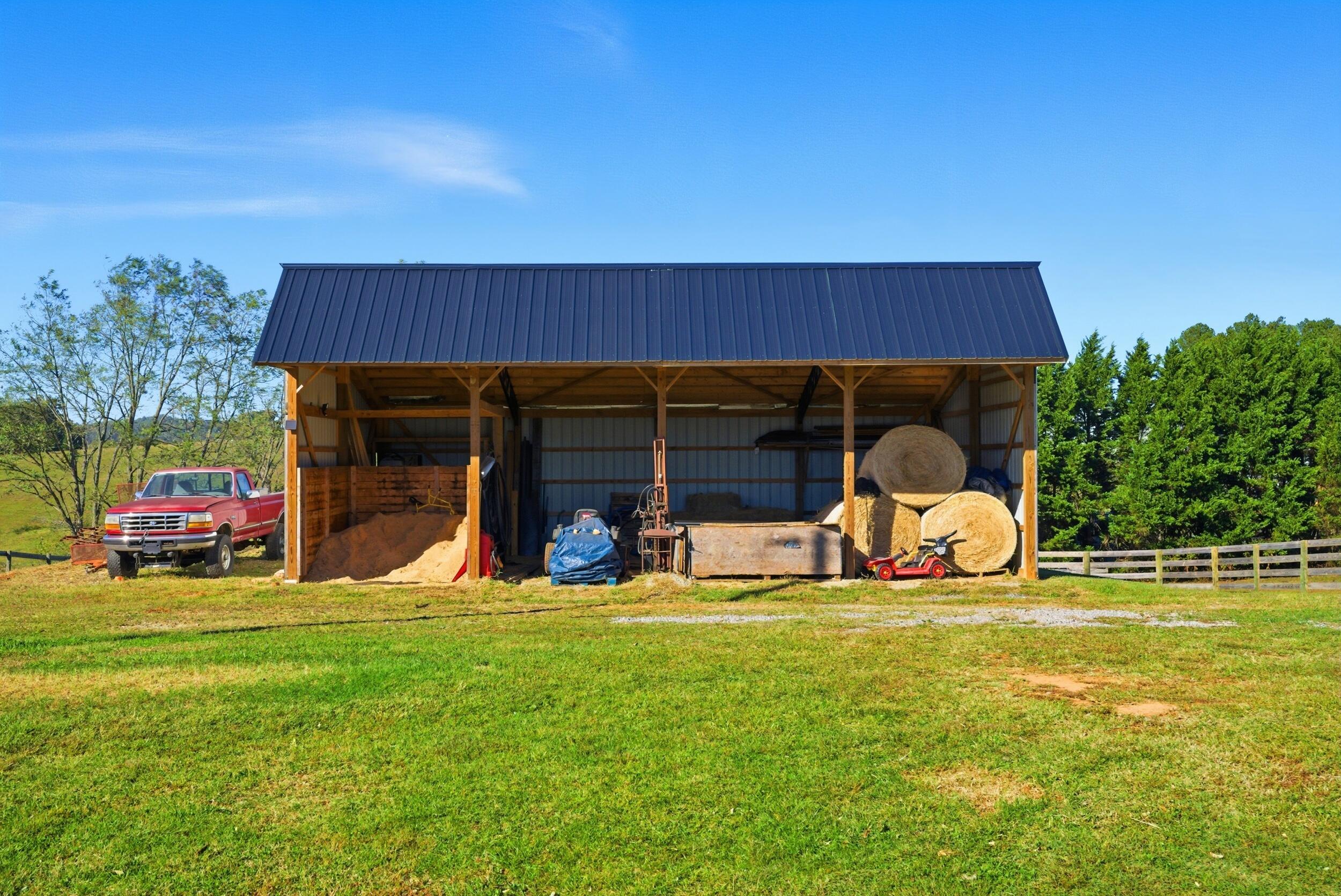 2631 Meadors Spur Road Moneta, VA 24121 - Photo 62 of 87 a view of a backyard with table and chairs and a fire pit