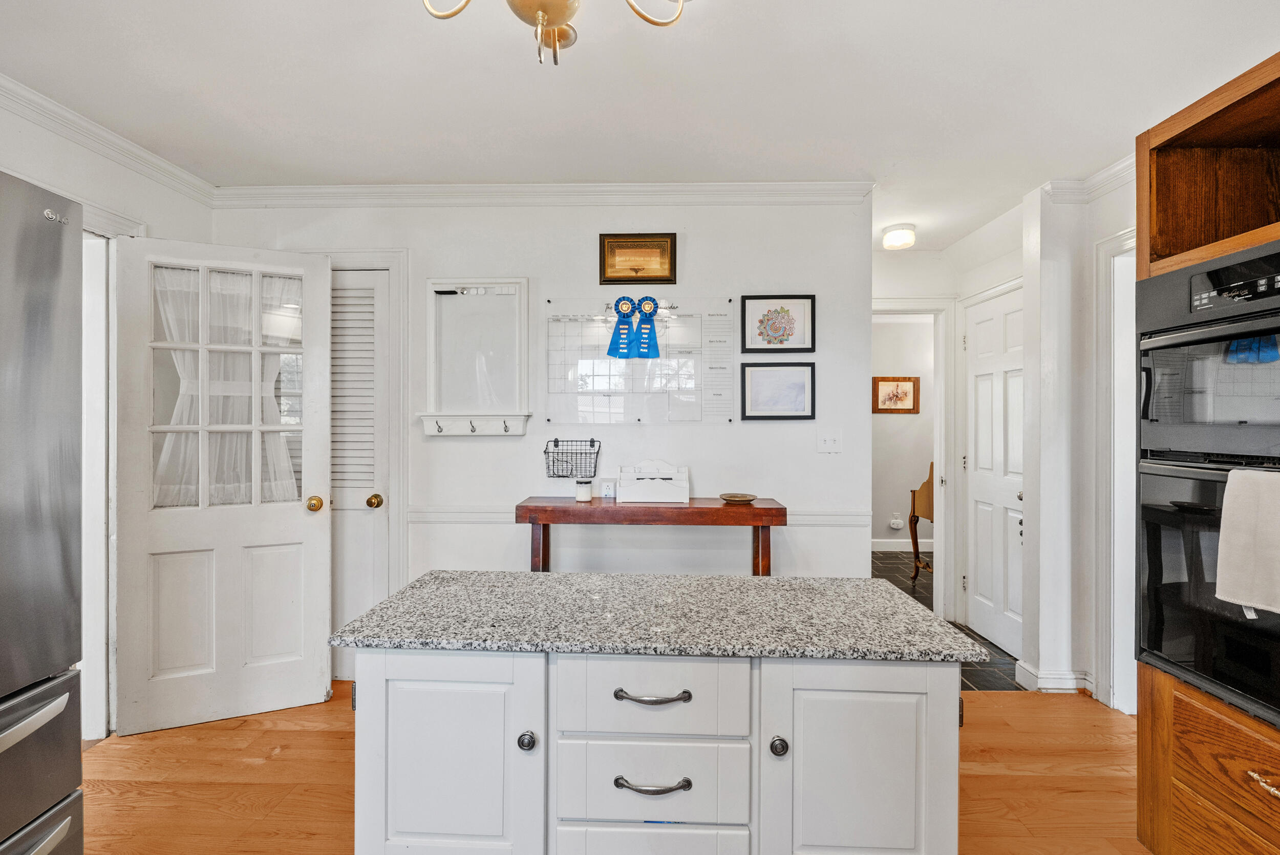 2631 Meadors Spur Road Moneta, VA 24121 - Photo 7 of 87 a bathroom with a granite countertop sink and a mirror