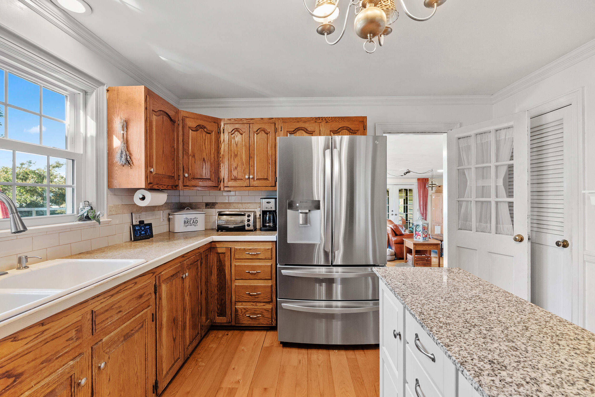 2631 Meadors Spur Road Moneta, VA 24121 - Photo 8 of 87 a kitchen with stainless steel appliances granite countertop a refrigerator a sink dishwasher a stove with wooden cabinets and floor