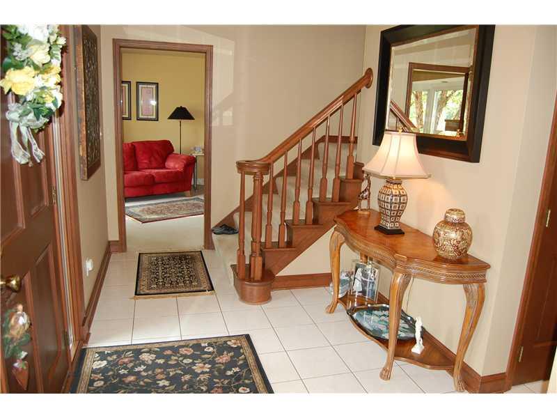 Entry/Foyer. *GRACIOUS CERAMIC TILE ENTRANCE FOYER WITH TURNED STAIRCASE