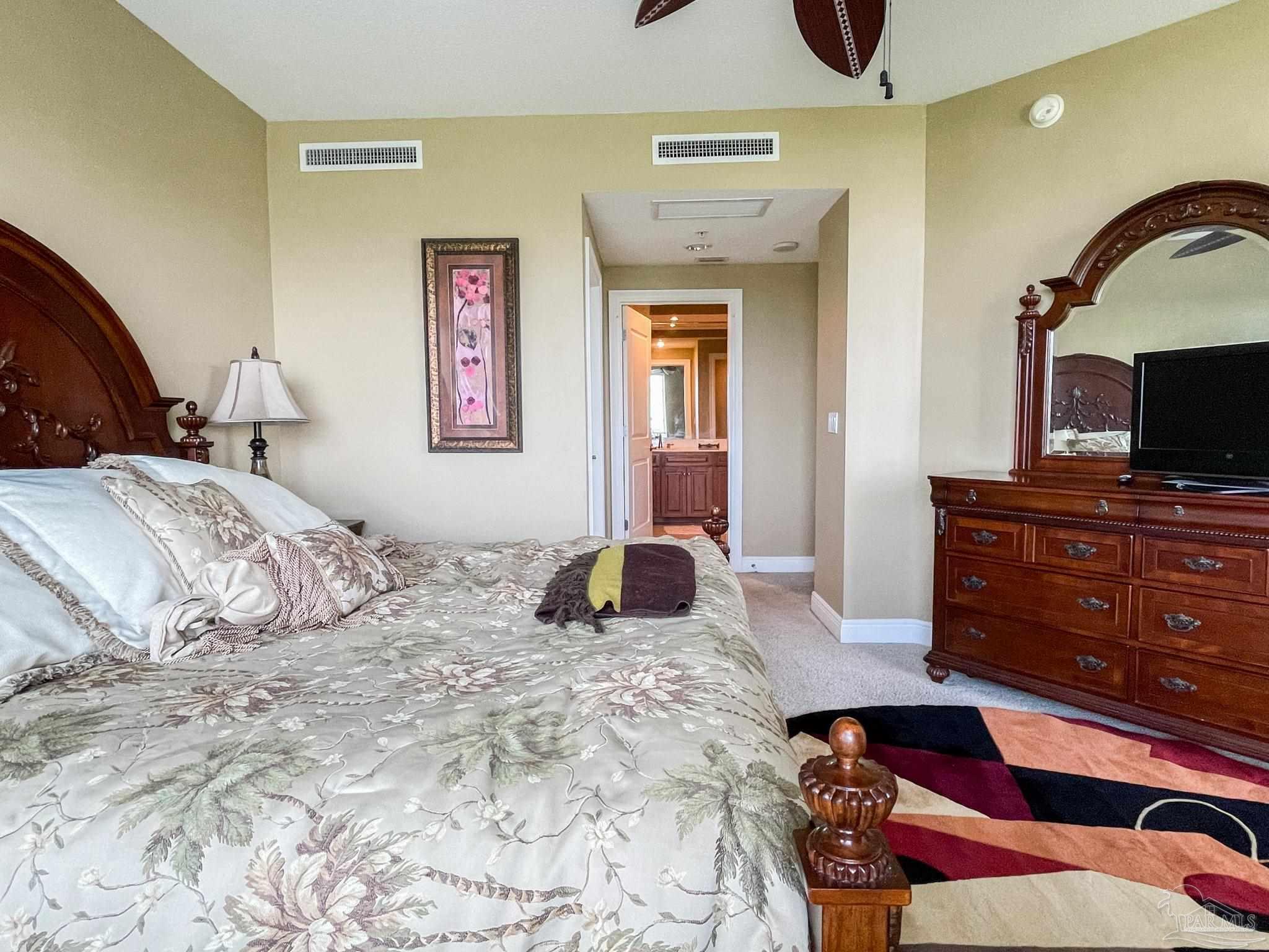 608 Lost Key Drive, Unit 604C Perdido Key, FL 32507 - Photo 11 of 38 a bedroom with a bed and a dresser