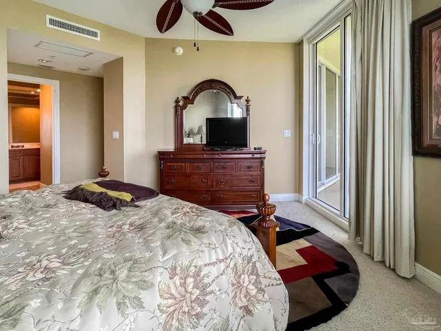 a bedroom with a bed and a dresser