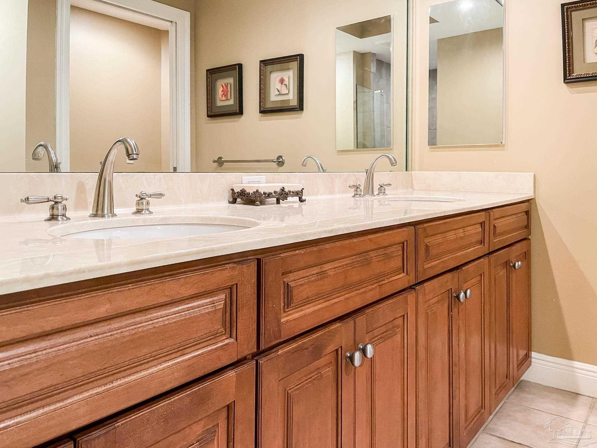 608 Lost Key Drive, Unit 604C Perdido Key, FL 32507 - Photo 16 of 38 a bathroom with a sink and a mirror