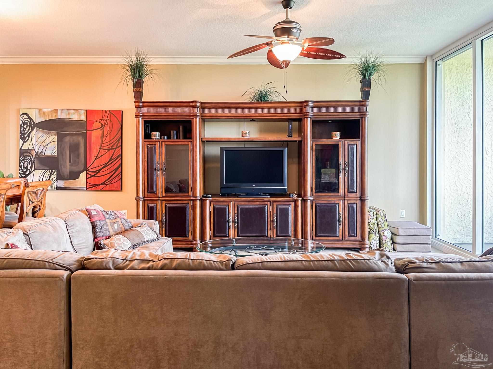 608 Lost Key Drive, Unit 604C Perdido Key, FL 32507 - Photo 17 of 38 a living room with furniture and a flat screen tv