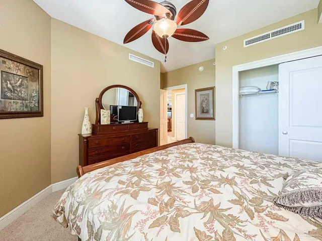 a bedroom with a bed and a dresser