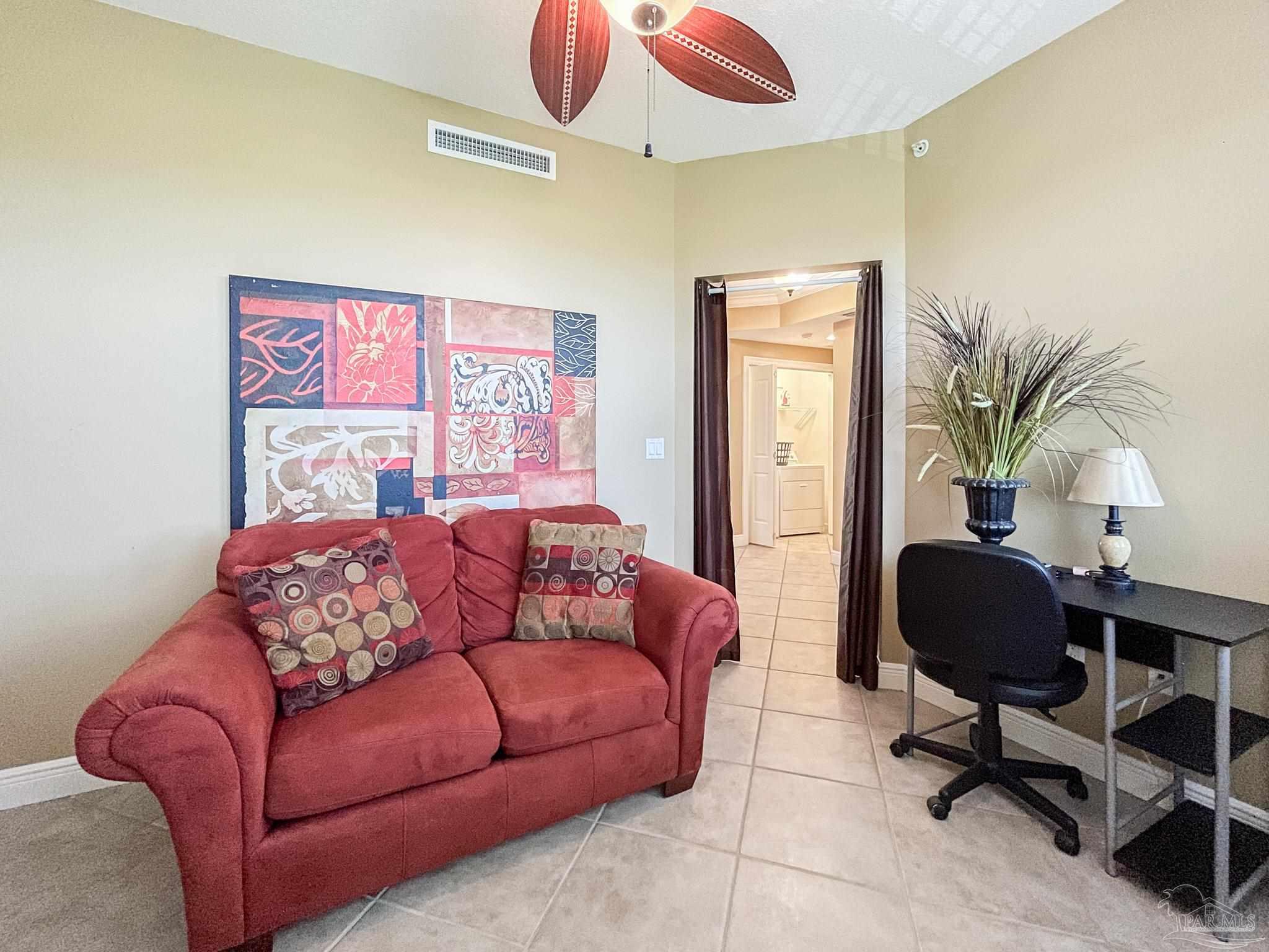 608 Lost Key Drive, Unit 604C Perdido Key, FL 32507 - Photo 28 of 38 a living room with furniture and a potted plant