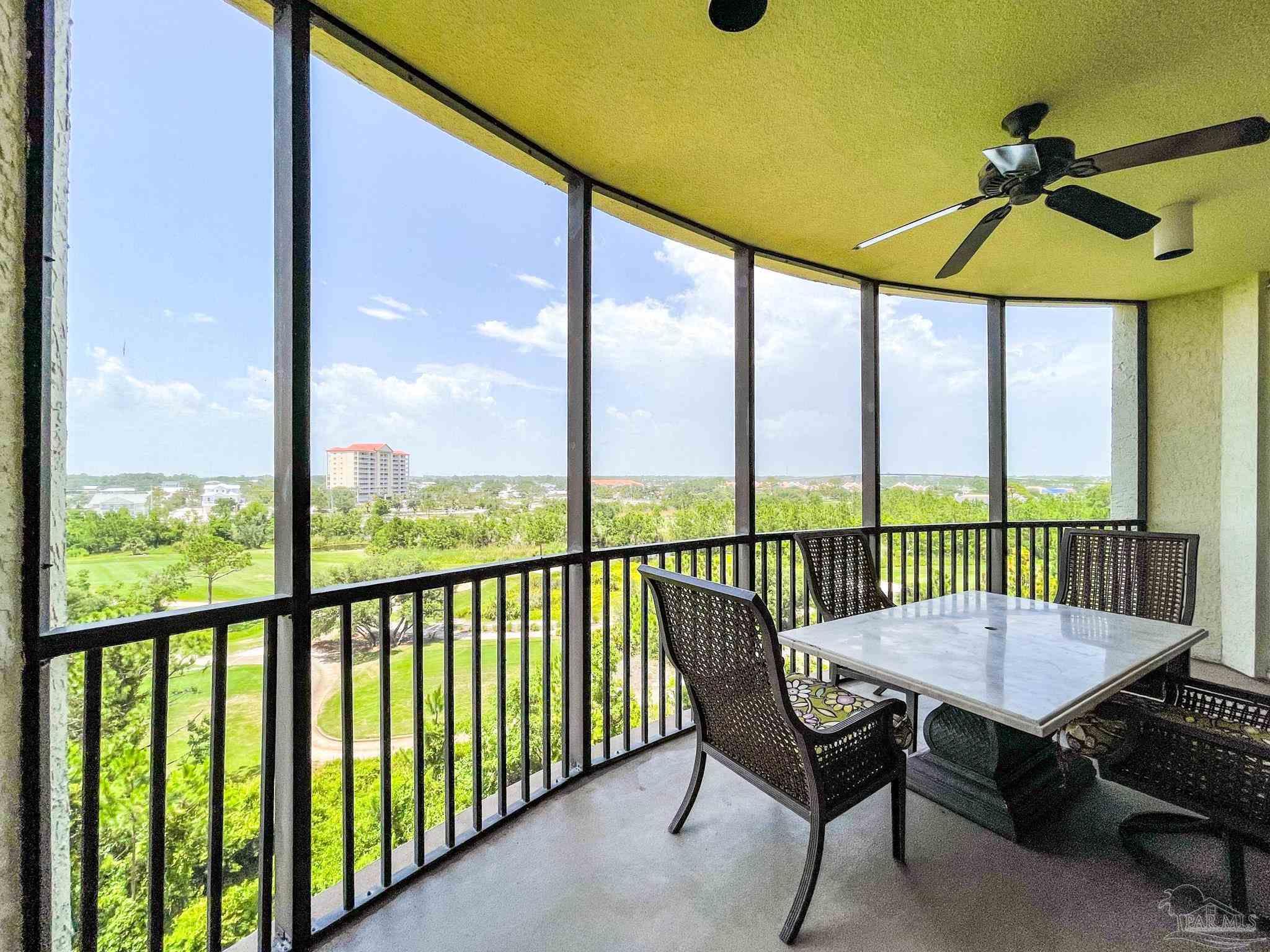 608 Lost Key Drive, Unit 604C Perdido Key, FL 32507 - Photo 32 of 38 a view of a balcony with furniture and a yard