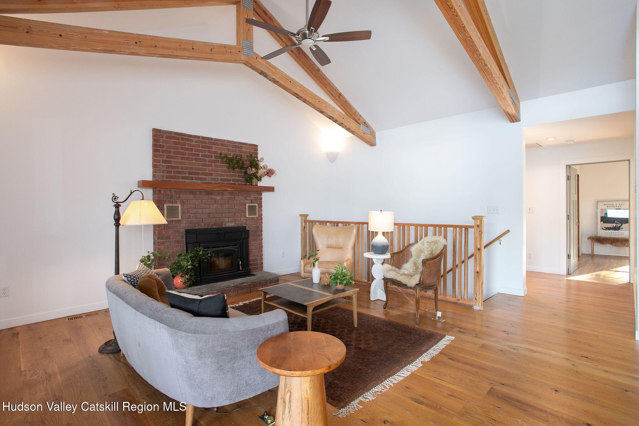 1084 Lakeview Road Copake, NY 12516 - Photo 12 of 33 a living room with furniture and a fireplace