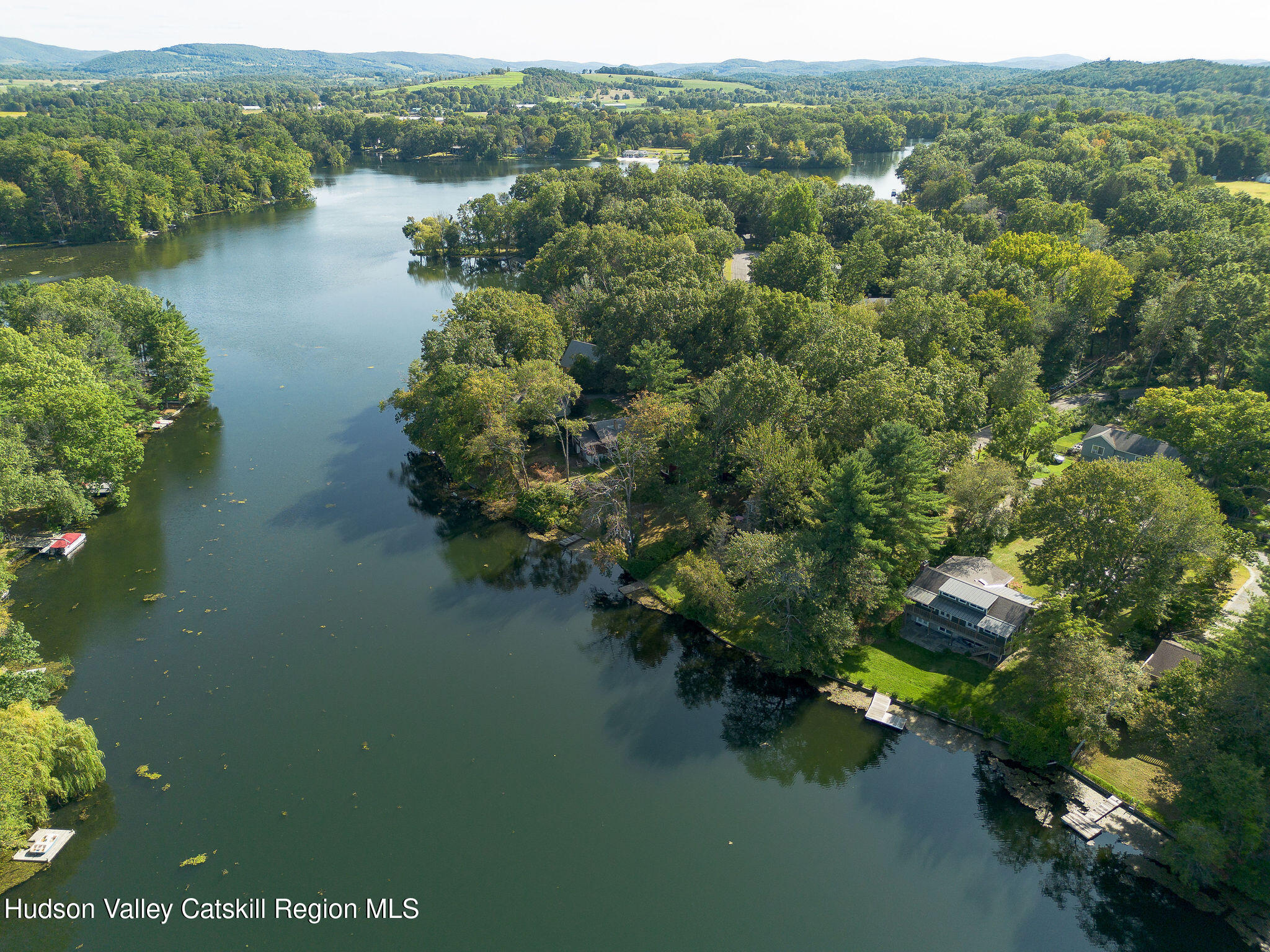 1084 Lakeview Road Copake, NY 12516 - Photo 24 of 33 a view of a lake with houses