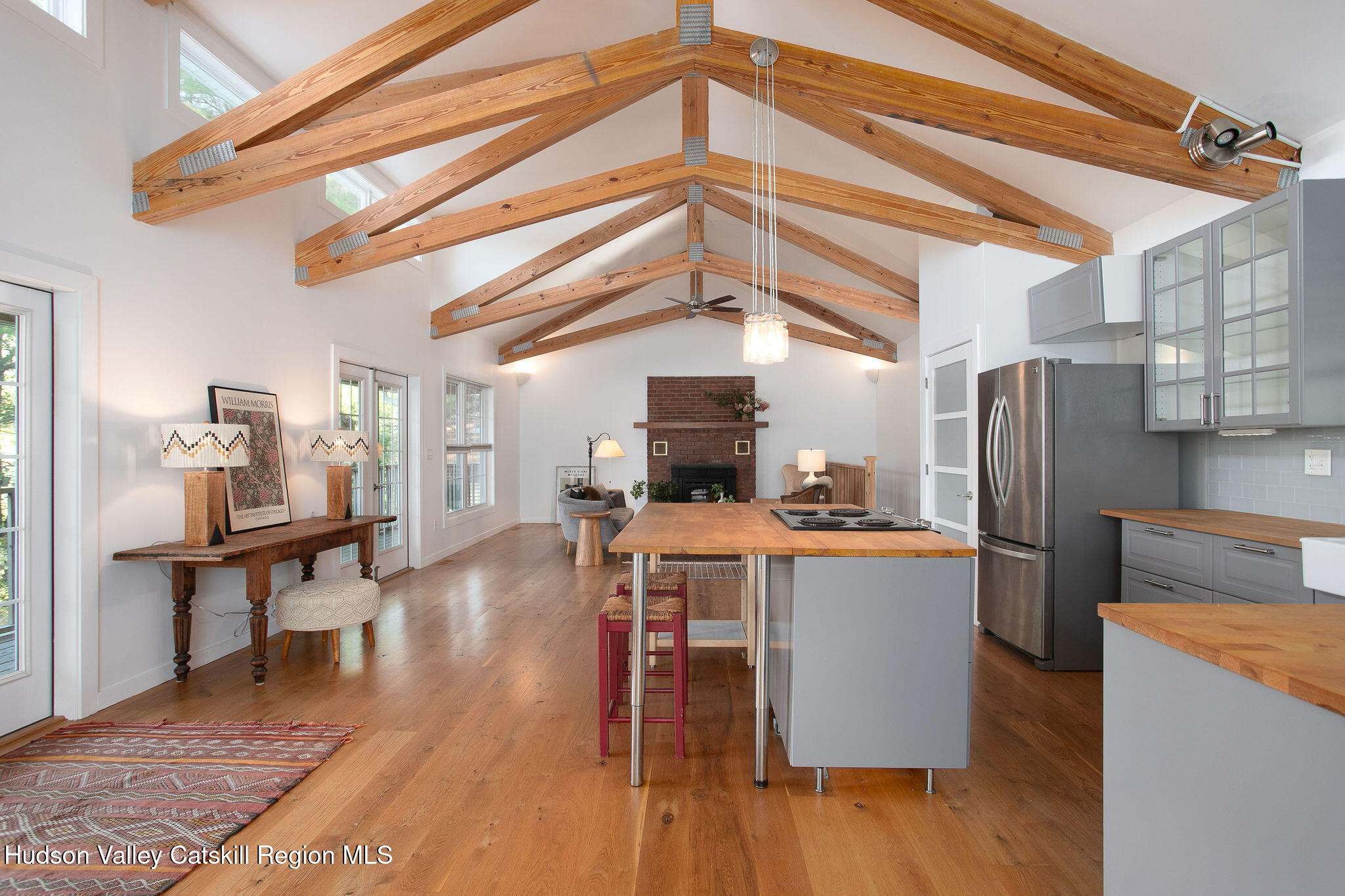 1084 Lakeview Road Copake, NY 12516 - Photo 32 of 33 a kitchen with stainless steel appliances a stove a refrigerator and a dining table