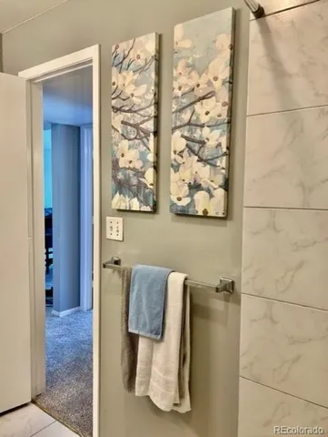 a bathroom with a shower and mirror