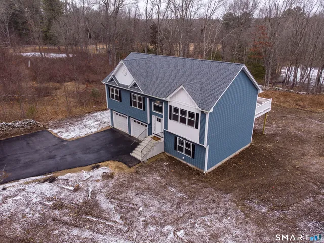 a large white kitchen with wooden floors