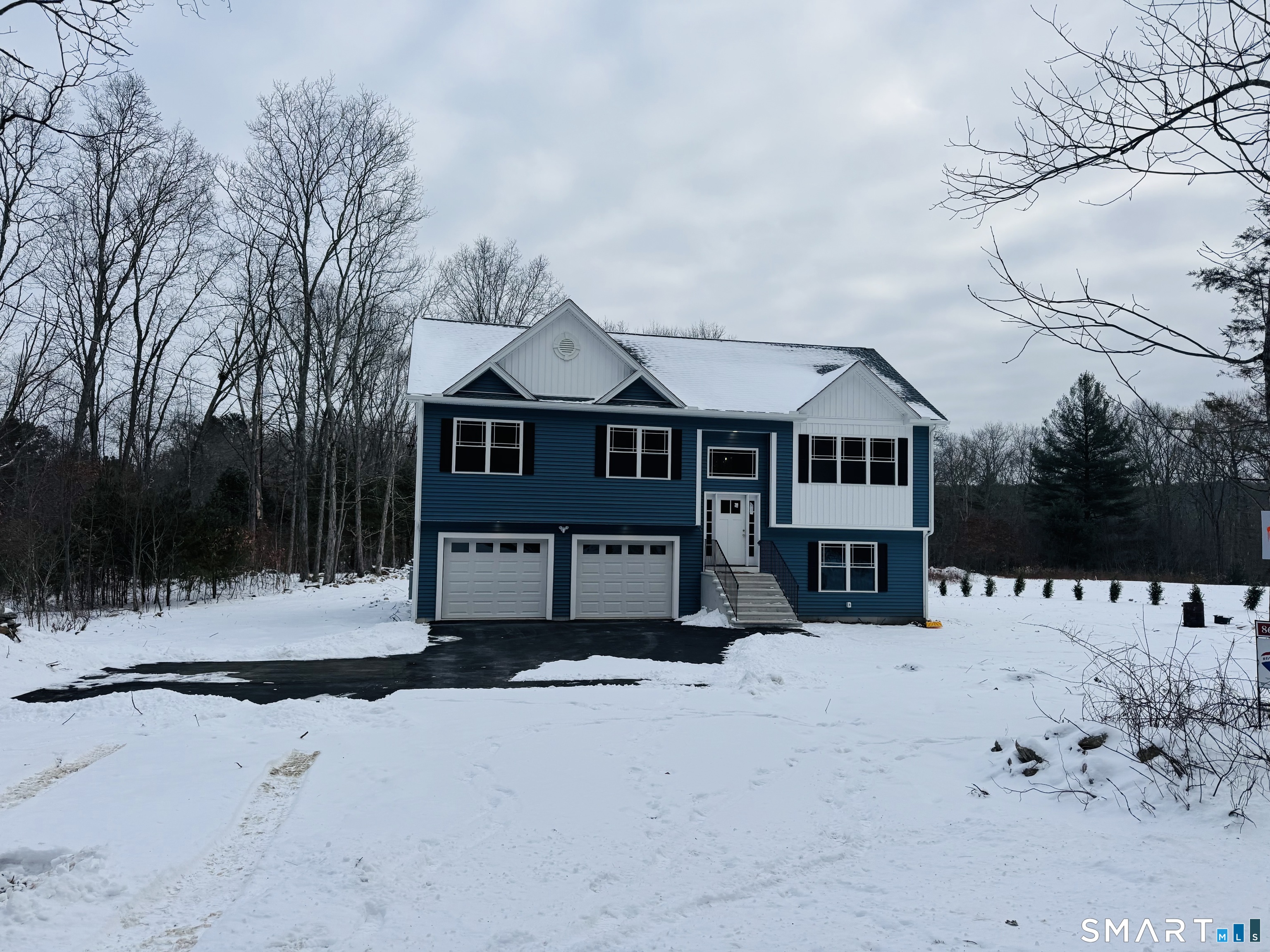890 Brook Road Scotland, CT 06264 - Photo 16 of 23 a front view of a house with a yard covered in snow
