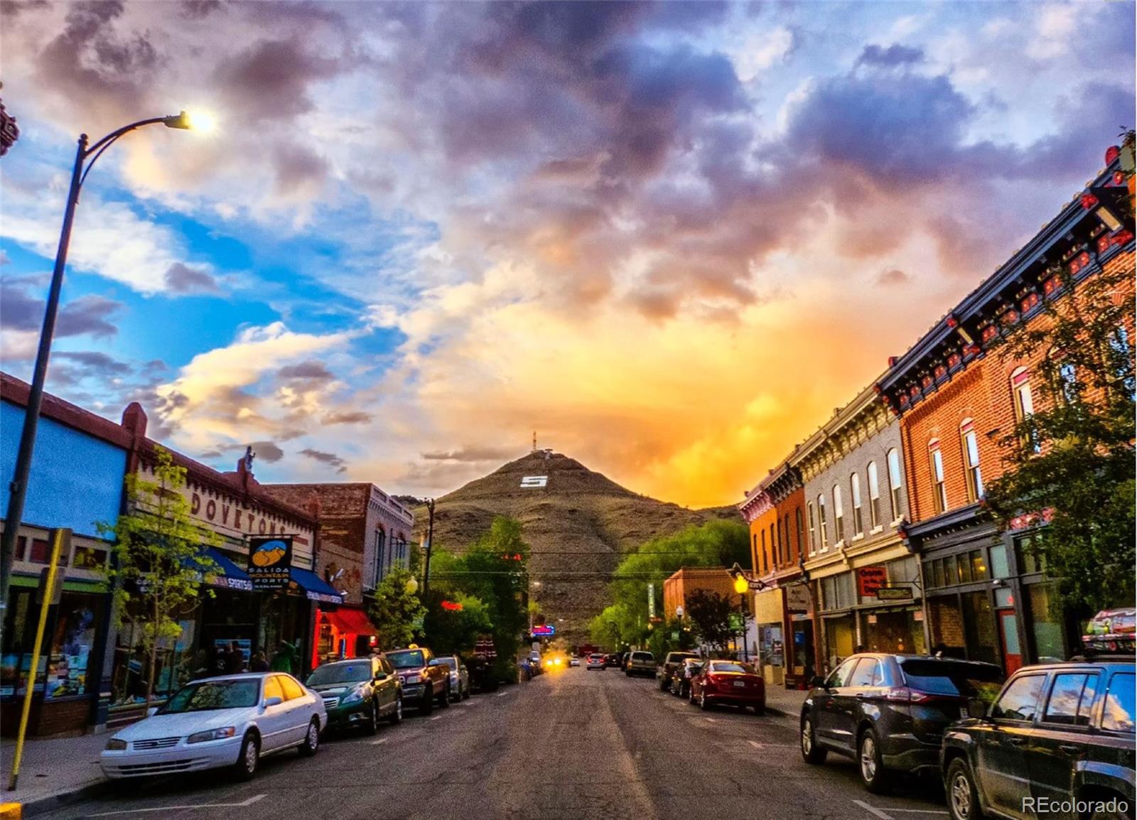 207.5 F Street, Unit 3 Salida, CO 81201 - Photo 1 of 14 a city street lined with parked cars and buildings