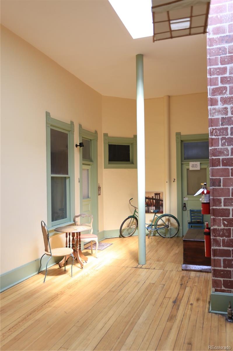 207.5 F Street, Unit 3 Salida, CO 81201 - Photo 12 of 14 a view of a chairs and table on the wooden floor