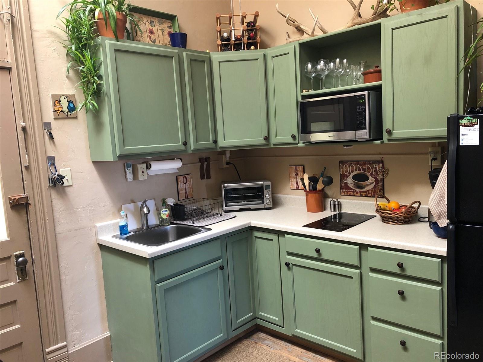 207.5 F Street, Unit 3 Salida, CO 81201 - Photo 3 of 14 a kitchen with a sink and cabinets