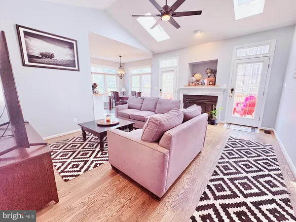 a living room with furniture and a rug