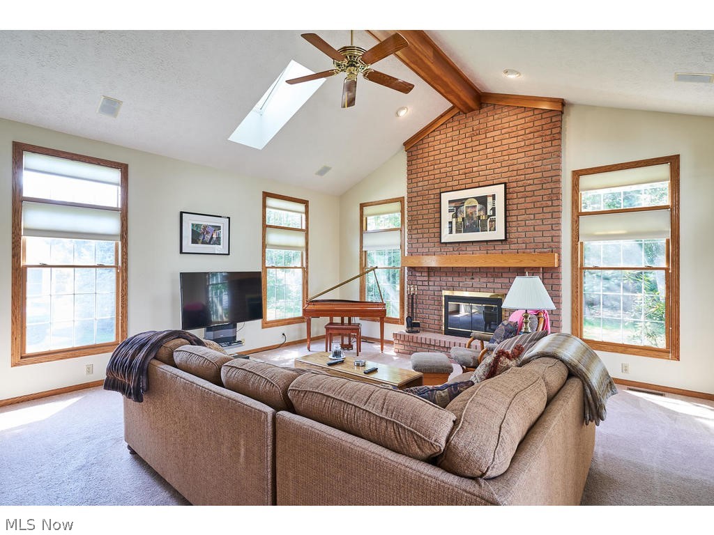 2460 Shadow Ridge Lane Fairlawn, OH 44333 - Photo 9 of 29 Great room with beamed vaulted ceilings and skylights! Extra windows too makes this room so cheery!