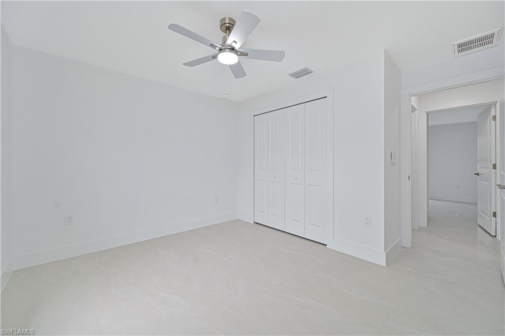 640 Lydia Street Lehigh Acres, FL 33974 - Photo 23 of 26 an empty room with a ceiling fan and a window