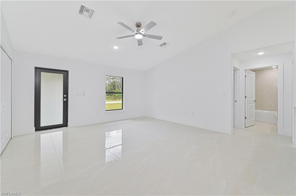 640 Lydia Street Lehigh Acres, FL 33974 - Photo 9 of 26 an empty room with fan and windows