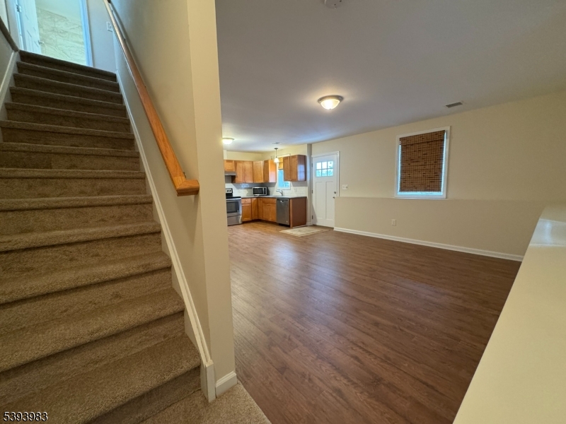 85 Highway 206, Unit A Augusta, NJ 07822 - Photo 17 of 42 a view of a livingroom with wooden floor and stairs