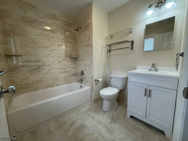 a bathroom with a sink a toilet and a bathtub