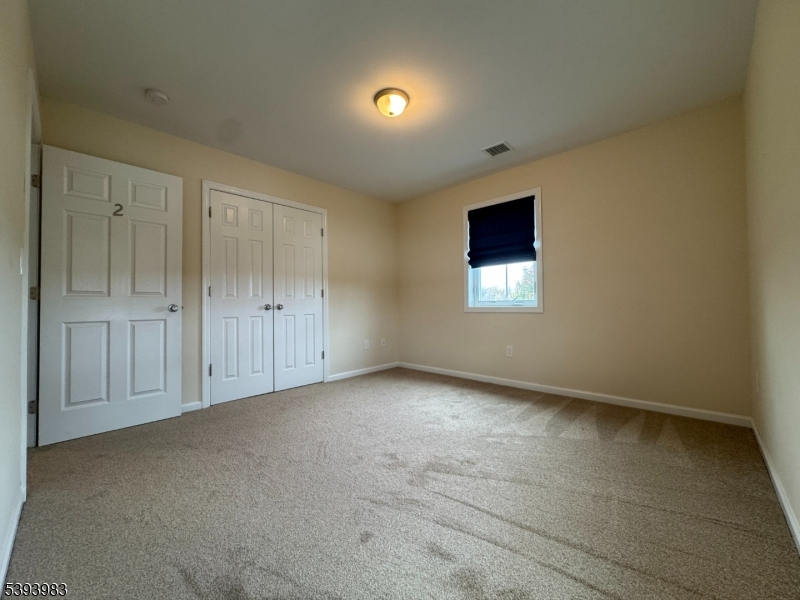 85 Highway 206, Unit A Augusta, NJ 07822 - Photo 21 of 42 an empty room with windows and closet