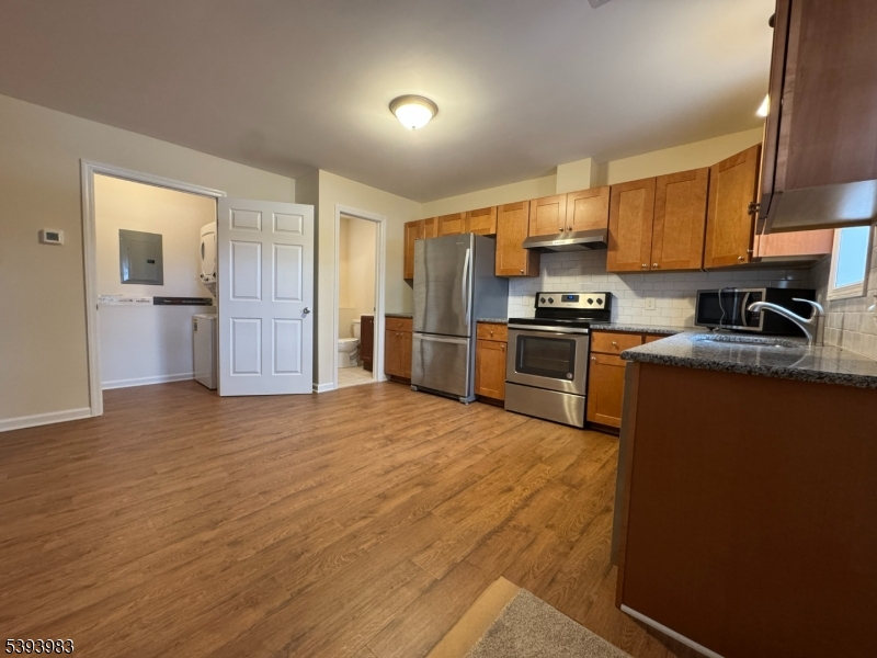 85 Highway 206, Unit A Augusta, NJ 07822 - Photo 3 of 42 a kitchen with stainless steel appliances granite countertop a refrigerator sink and cabinets