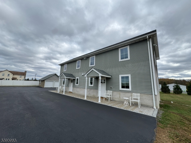 85 Highway 206, Unit A Augusta, NJ 07822 - Photo 38 of 42 a front view of a house with a yard and garage