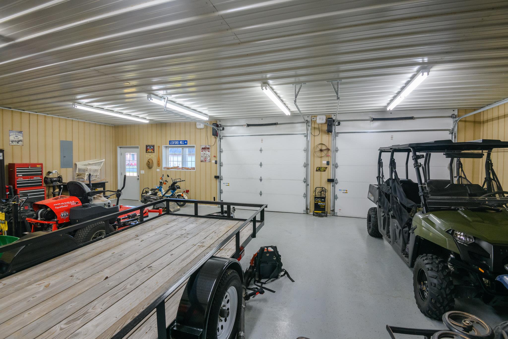 1195 Motlow College Road Normandy, TN 37360 - Photo 28 of 29 Insulated garage doors and water in the workshop