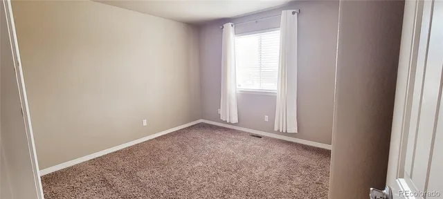 a bathroom with a bathtub sink and mirror
