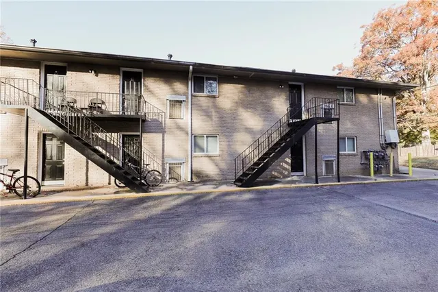 a view of an empty room with stairs