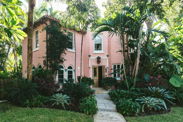 a front view of a house with garden