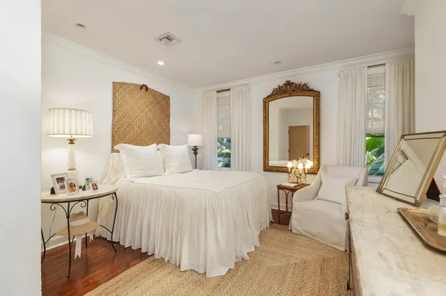 a bedroom with a bed and a couch